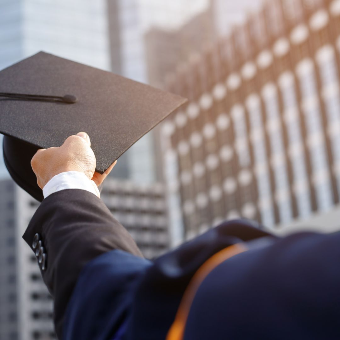 Graduate throwing hat